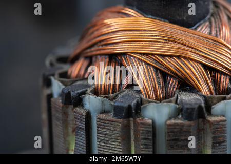 Copper commutator bar of the electric motor close up. Electric motor rotor Stock Photo