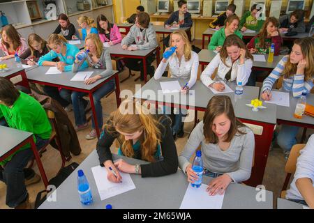 Netherlands - Students drinking water during a long test at school in  Arnhem Stock Photo