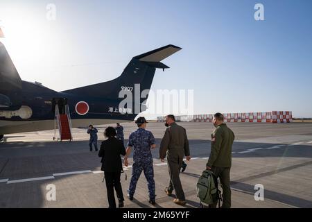 Maj. Gen. Eric Hill, Air Force Special Operations Command deputy commander, center right, and Maj. Gen. Leonard Kosinski, 5th Air Force deputy commander, far right, board a ShinMaywa US-2 assigned to the Japanese Maritime Self-Defense Force's Air Patrol Squadron 71 at Marines Corps Air Station Iwakuni, Japan, April 5, 2022. During the visit the generals were able to witness the unique search, rescue, and personnel recovery capabilities the amphibious aircraft delivers firsthand. Stock Photo