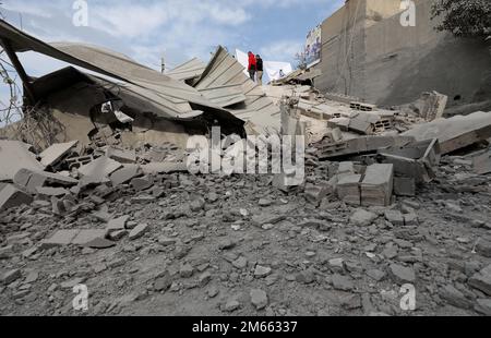 (230102) -- JENIN, Jan. 2, 2023 (Xinhua) -- People inspect the site where a house was demolished after clashes in the Kufr Dan village, west of the northern West Bank city of Jenin, on Jan. 2, 2023. The Israeli army killed two Palestinians, including a member of an armed group, in clashes in a village in the occupied West Bank early Monday, Palestinian and Israeli sources said. The Israeli military said in a statement that the soldiers entered the Kufr Dan village to demolish the homes of two Palestinian 'assailants' who killed an Israeli military officer in a firefight in September last year. Stock Photo