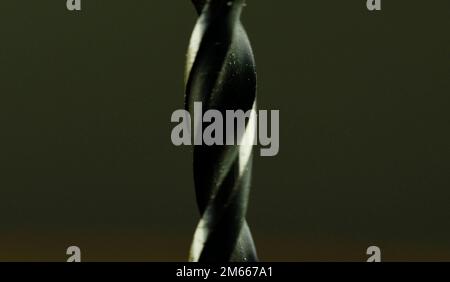 Detail of drill on black background. Concept for carpentry, crafts, DIY. Macro and close-up image. Stock Photo