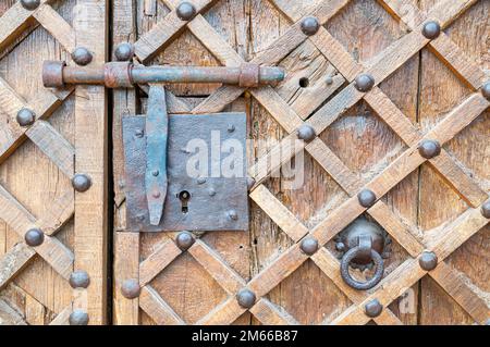 wooden door detail of Santa Maria Church of Cubells, Late Romanesque style church, the only vestige of Cubells castle. Cubells, Catalonia, Spain Stock Photo