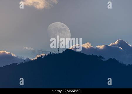 The first Moon of 2023 in the cold winter... with multiple exposure we improve the observed reality... Stock Photo