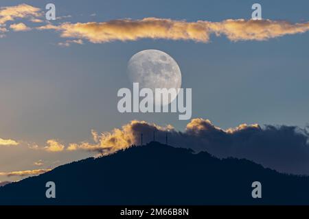 The first Moon of 2023 in the cold winter... with multiple exposure we improve the observed reality... Stock Photo