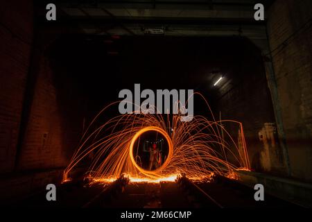 Long exposure photography of steel wool, light painting at night Stock Photo