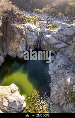 Aerial view of Zorro Canyon Waterfall in the ecological ranch Sol De Mayo on a sunny day in Santiago, Baja California Sur, Mexico Stock Photo