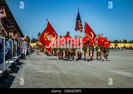 U.S. Marines with Delta Company, 1st Recruit Training Battalion, run in formation during a motivational run at Marine Corps Recruit Depot San Diego, April 7, 2022. The Marines leading from the front were responsible for the training and organization of 1st Recruit Training Battalion. Stock Photo