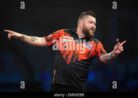 Michael Smith in action against Rob Cross (not pictured) on night ...