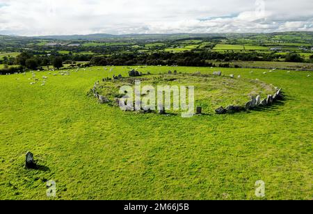 Beltany prehistoric stone circle. Raphoe, Donegal, Ireland. Neolithic and Bronze Age ritual site 2100-700 BC. Outlier stone bottom left. Aerial Stock Photo