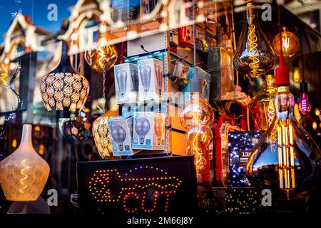 An electrical shop window with an array of different light fittings and bulbs.Weird and wonderful shapes illustrating energy and electricity. Stock Photo