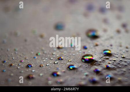Close-up of bubbles on the surface of a cup of coffee, with a blurry background. Stock Photo