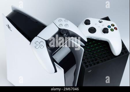 New york, USA - December 28, 2022: Next generation game consoles Microsoft  xbox and sony playstation with game pads isolated on white studio backgroun  Stock Photo - Alamy