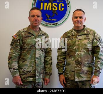 U.S. Army Southern European Task Force, Africa Commanding General Maj. Gen. Andrew Rohling stands with Brig. Gen. Timothy Brennan. Brennan, commanding general, 353rd Civil Affairs Command, visited Rohling's SETAF-AF headquarters during a joint task force command post exercise April 9, 2022, in Vicenza, Italy. Brennan also visited 353rd CACOM Soldiers supporting the exercise and real-world activities in Europe and Africa. The 353rd CACOM, a U.S. Army Reserve unit out of Staten Island, N.Y., plans expeditionary Civil Affairs Operations and enables Civil-Military Operations in support of US Europ Stock Photo