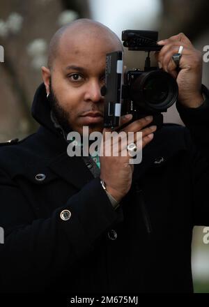 Cleveland Brown V poses for a portrait at Silver Lake Park in Dover, Delaware, April 9, 2022. Brown is a member of the Dover Spouse’s Club and plays an active role in the community as a photographer. Stock Photo