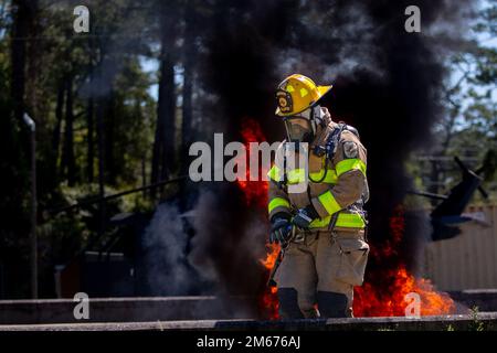 A firefighter with Camp Lejeune Fire and Emergency Services Division ...
