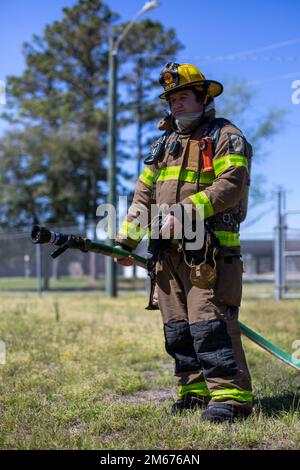 A firefighter with Camp Lejeune Fire and Emergency Services Division ...