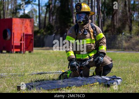 A firefighter with Camp Lejeune Fire and Emergency Services Division ...