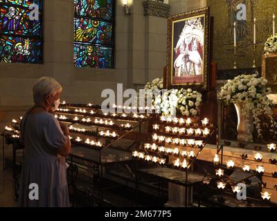Manila, Philippines. 02nd Jan, 2023. An old woman seen praying for the repose of the soul of the late Pope Emeritus Benedict XVI. Catholic devotees pay their last respect to Pope Emeritus Benedict XVI by offering prayers, lighting of candles, and writing the book of condolences for the late pontiff at the Christ the King Chapel of the Manila Cathedral on Monday, January 2. The late pope whose birth name was Joseph Aloisius Ratzinger died at the age of 95 last December 31, 2022 at the Mater Ecclesiae Monastery in Vatican City. Credit: SOPA Images Limited/Alamy Live News Stock Photo