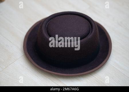 Brown Hat on White Wooden Floor Close Up Stock Photo