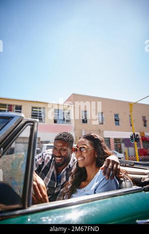 Its never too late to change your path. a young couple reading a map while sitting in the car. Stock Photo
