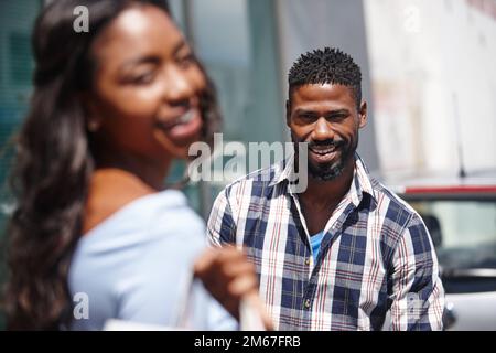 Shes the best part of my day. a handsome man posing with his girlfriend in the foreground. Stock Photo