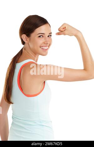 Portrait of a young woman flexing her muscles Stock Photo - Alamy