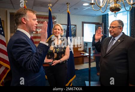 WASHINGTON (April 13, 2022) — The Honorable Erik K. Raven, left, is sworn in as the 34th Under Secretary of the Navy by Secretary of the Navy Carlos Del Toro April 13, 2022. Raven was confirmed as the 34th Under Secretary of the Navy April 7, 2022. Stock Photo