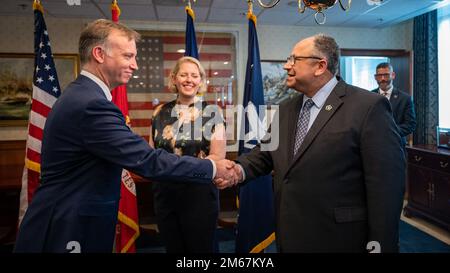 WASHINGTON (April 13, 2022) — The Honorable Erik K. Raven, left, is sworn in as the 34th Under Secretary of the Navy by Secretary of the Navy Carlos Del Toro April 13, 2022. Raven was confirmed as the 34th Under Secretary of the Navy April 7, 2022. Stock Photo