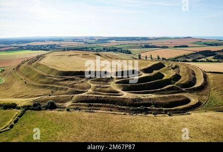 Maiden Castle, Dorset, England, dates from 4000 BC causewayed enclosure. View east across ramparts and ditches of Iron Age hillfort west entrance Stock Photo