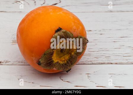Fresh ripe persimmon isolated on white background Stock Photo
