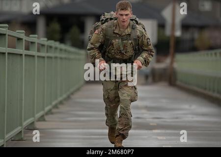 Boise State University Army ROTC Cadet Bo Carlton, a freshman, crossing another bridge back over the Boise River nearing the halfway point at Barber Park. Cadet Carlton was the first cadet to complete the 12-mile ruck march with a time of 1 hour and 42 minutes.    The Boise State University ROTC Cadets nearing the end of the semester showed no let up in their schedules. In mid-April, two groups of cadets took a scenic ruck march along the Boise Green Belt Trail system. Group one completed a 12-mile ruck march while group 2 completed an 8-mile march.    Seeking fitness of another kind, the cade Stock Photo