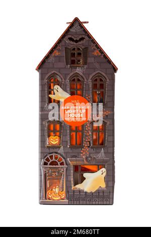 Halloween tin isolated on white background - all butter biscuit light up house with a creepy orange LED tea light from M&S Stock Photo