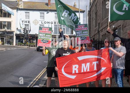 Striking RMT workers on a picket line at Penzance Railway station in Cornwall. Stock Photo