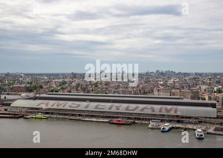 amsterdam aerial view onto amsterdam centraal station with city in background and nordzeekanal Stock Photo