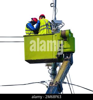 Male workers repairing a security camera tower while standing at a high altitude, isolated on a white background Stock Photo
