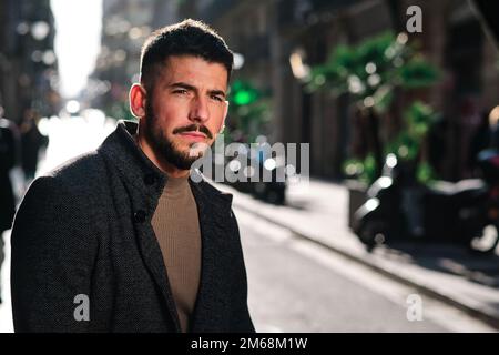 Portrait of a gorgeous stylish man in the street Stock Photo