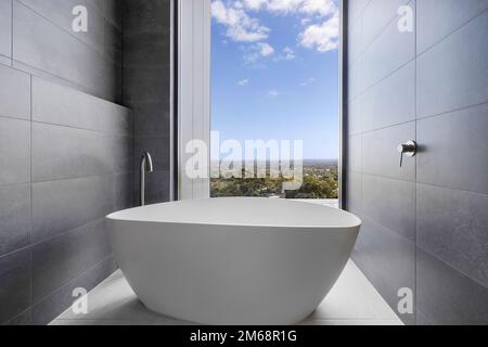 Luxurious free standing bath tub with a view Stock Photo