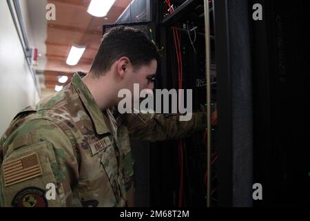 Senior Airman Nathan Kennedy, 608th Air Communications Squadron system administrator, inspects servers in the 608th ACOMS data center. An important part of his job is to ensure all systems are on and running 24/7 with the most current upgrades. 8th Air Force,AFGSC,Barksdale Air Force Base,Joint-Global Strike Operations Center,communications, Stock Photo