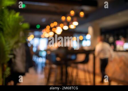 Blurred background of restaurant with bokeh lights Stock Photo