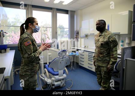 Lt. Gen. R. Scott Dingle, right, surgeon general of the Army and Medical Command commanding general, tours SHAPE Dental Clinic with Maj Autumn L. Becker, commander of SHAPE Dental Clinic, April 20, 2022 at SHAPE Healthcare Facility in Casteau, Belgium. Stock Photo