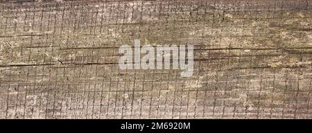 Dark brown scratched wooden cutting board. Wood texture. Stock Photo