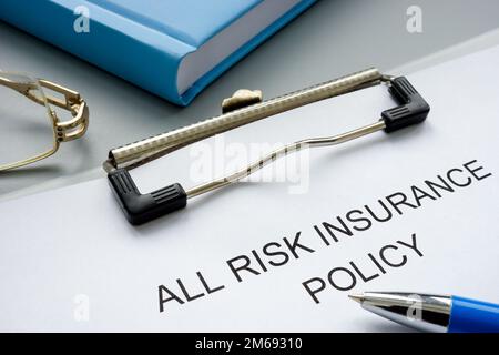 Clipboard with all risk insurance policy and pen. Stock Photo