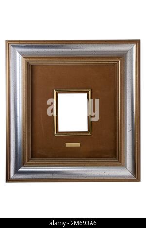 Antique golden and silver frame isolated on white background. Old wooden frame with decor painted with gold and silver paint. Italian heritage and ant Stock Photo