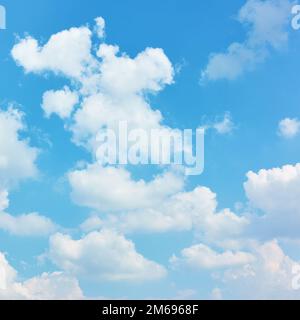 White heap clouds in the blue sky - background, cloudscape Stock Photo