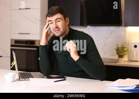 Tired worker suffering vision issues Stock Photo