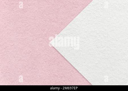 Texture of light pink paper background, half two colors with white arrow, macro. Structure of dense craft rose cardboard. Felt abstract backdrop close Stock Photo