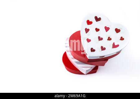 Heart shaped boxes decorated with pink and red hearts isolated on white background Stock Photo