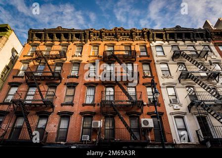 Historical buildings with fire escape stairs, The Bowery, a historic neighbourhood  in the Lower East Side of Manhattan, New York City, USA Stock Photo