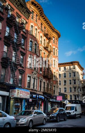 Historical buildings with fire escape stairs, The Bowery, a historic neighbourhood  in the Lower East Side of Manhattan, New York City, USA Stock Photo