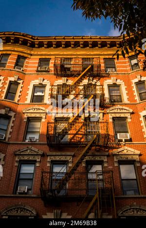 Historical buildings with fire escape stairs, The Bowery, a historic neighbourhood  in the Lower East Side of Manhattan, New York City, USA Stock Photo